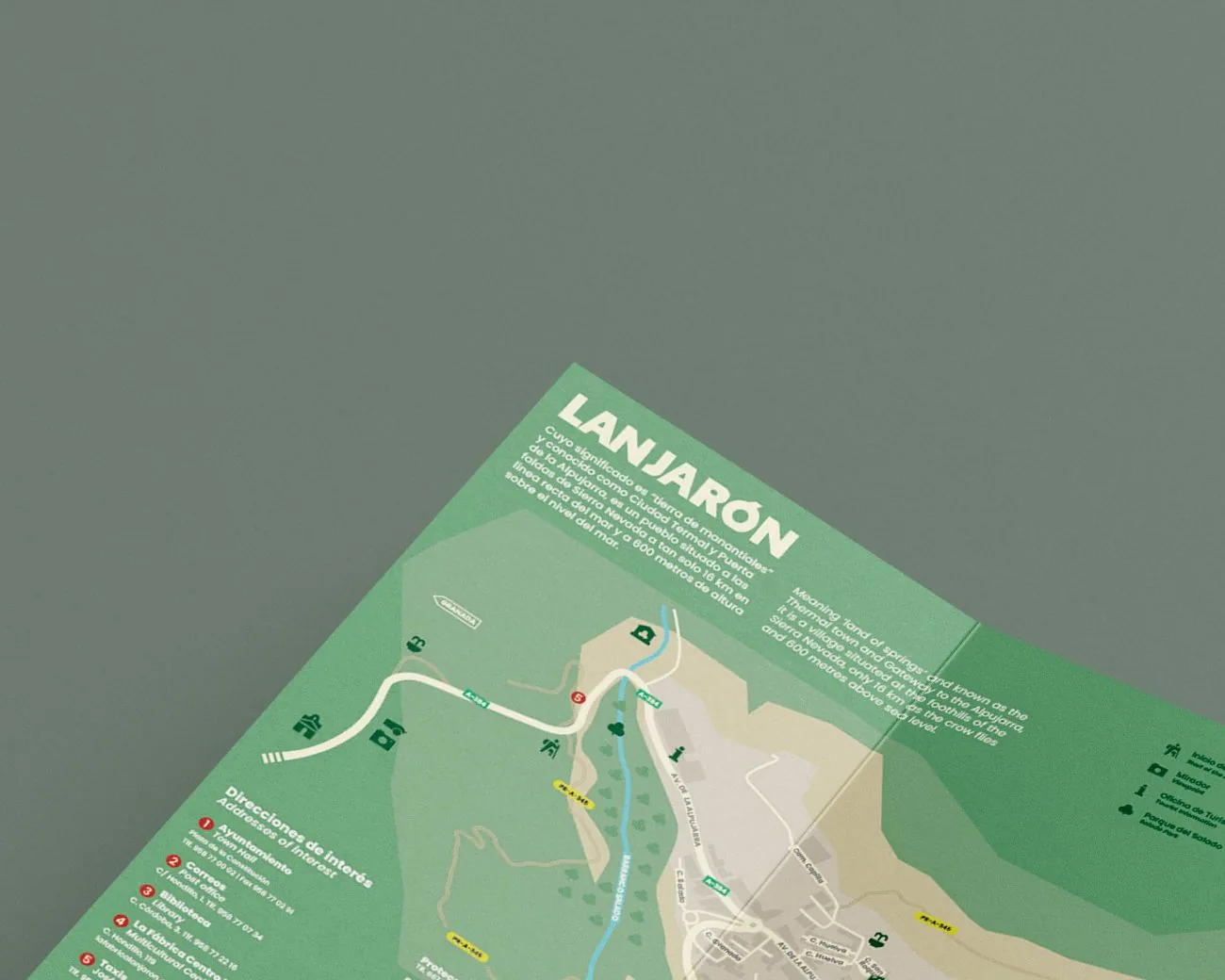 Esquina del mapa turístico de Lanjarón, con su título, sobre un fondo verde
